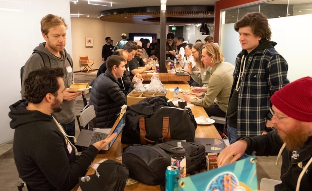 Casual work session with food and laptops